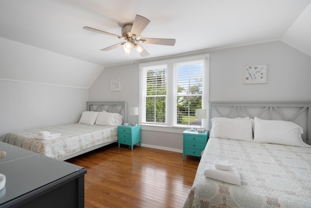 bedroom featuring vaulted ceiling, ceiling fan, and dark hardwood / wood-style floors