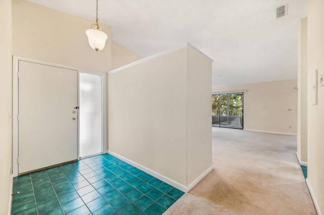 carpeted entryway featuring a textured ceiling and high vaulted ceiling