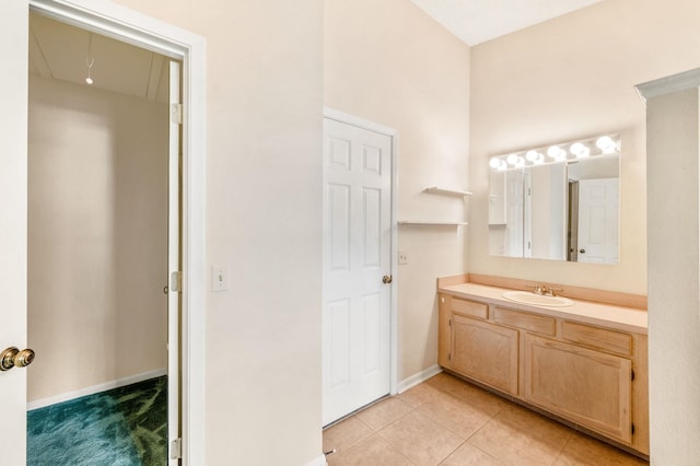 bathroom featuring tile patterned flooring and vanity