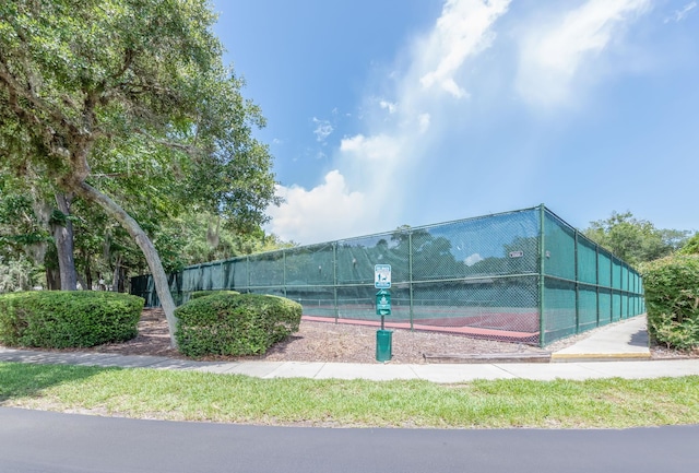 view of property's community with tennis court