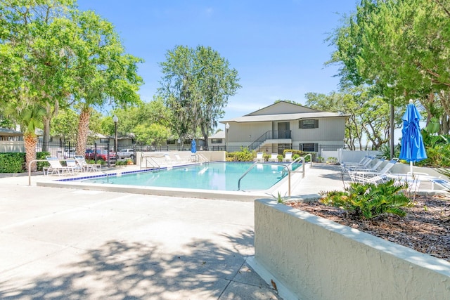 view of pool featuring a patio