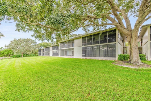 back of house with a yard