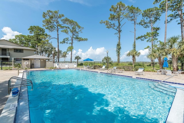 view of swimming pool featuring a patio