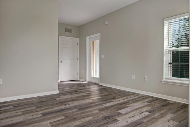 empty room featuring dark wood-type flooring