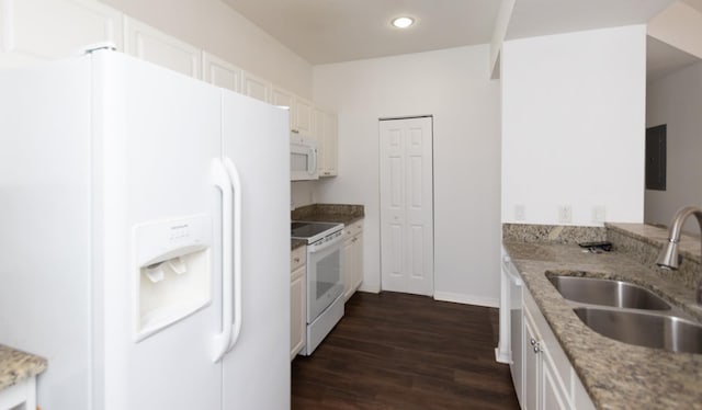 kitchen with white cabinetry, sink, white appliances, and light stone countertops