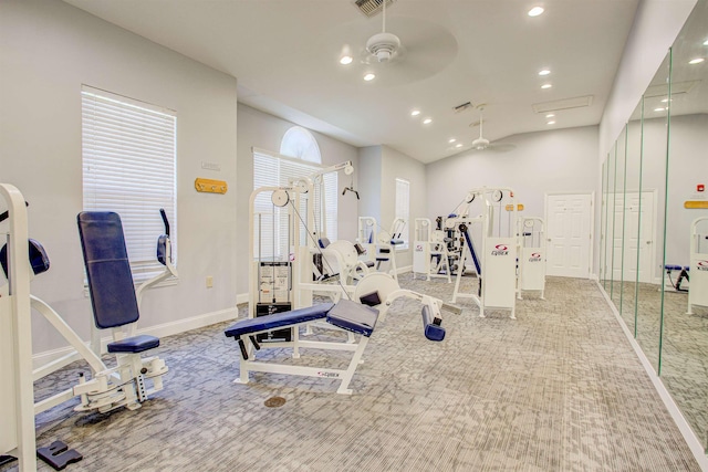 gym with ceiling fan and carpet