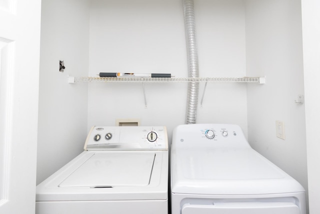 washroom featuring washing machine and dryer