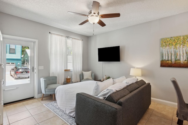 133 Pomar St, Saint Augustine, FL 32084 - living area with ceiling fan, light tile patterned flooring, and a textured ceiling