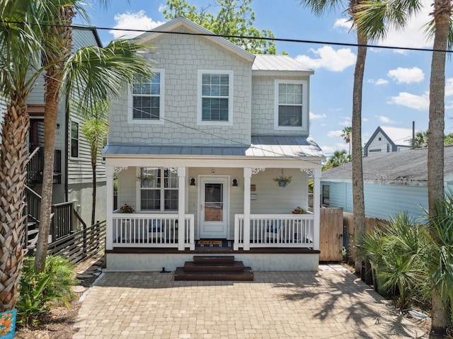 133 Pomar St, Saint Augustine, FL 32084 - view of front of house with a porch, a standing seam roof, and a metal roof