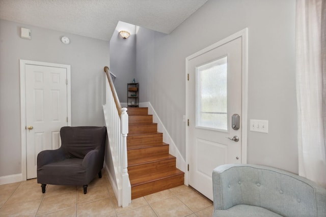 133 Pomar St, Saint Augustine, FL 32084 - foyer entrance featuring stairway and light tile patterned flooring