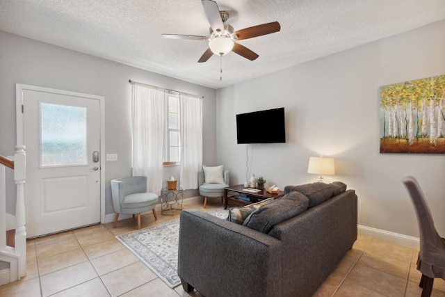 133 Pomar St, Saint Augustine, FL 32084 - living area with ceiling fan, light tile patterned floors, and a textured ceiling