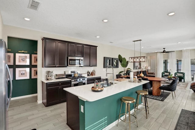 190 River Mist Dr, Saint Augustine, FL 32095 - kitchen featuring a sink, backsplash, a ceiling fan, appliances with stainless steel finishes, and visible vents