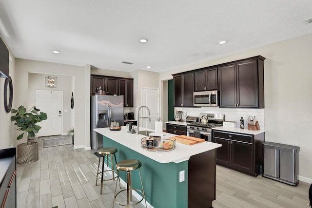 190 River Mist Dr, Saint Augustine, FL 32095 - kitchen with light countertops, a sink, backsplash, appliances with stainless steel finishes, and visible vents