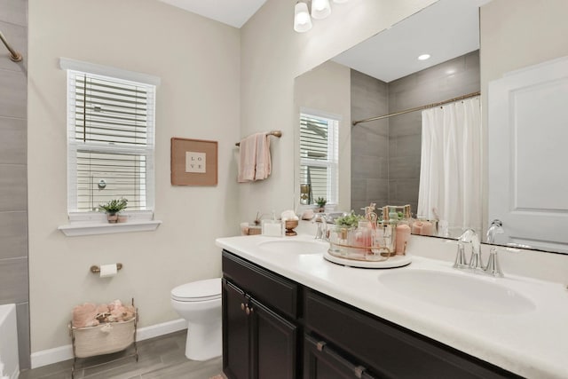 190 River Mist Dr, Saint Augustine, FL 32095 - full bathroom featuring baseboards, a sink, a tile shower, and toilet