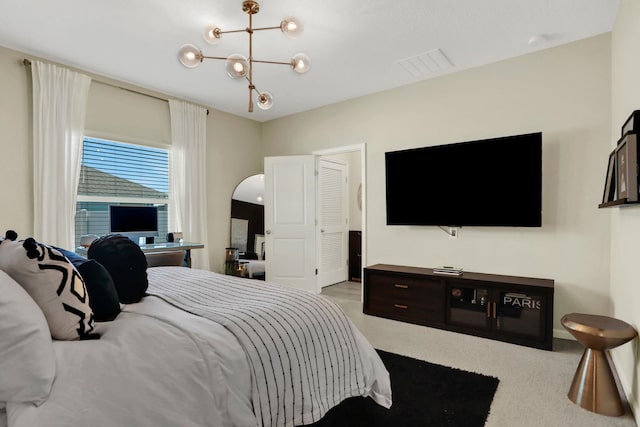 190 River Mist Dr, Saint Augustine, FL 32095 - bedroom with visible vents, arched walkways, and a chandelier