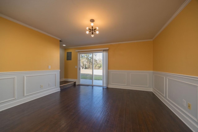 unfurnished room with a notable chandelier, ornamental molding, and dark hardwood / wood-style floors