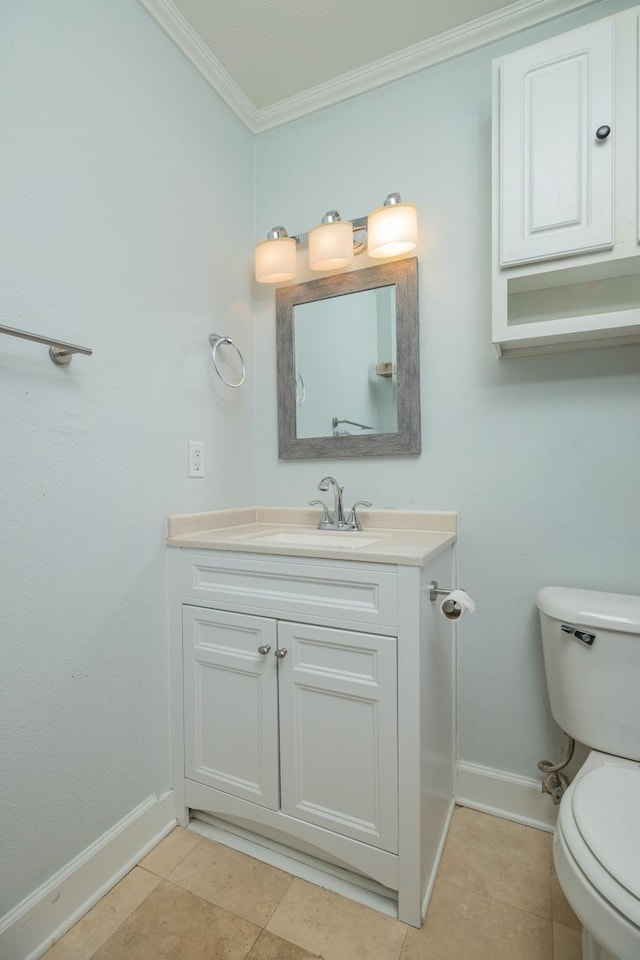 bathroom featuring crown molding, toilet, tile patterned flooring, and vanity