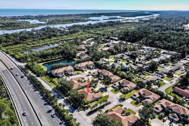 2001 Palm Dr Unit 101, Flagler Beach, FL 32136 - birds eye view of property featuring a water view and a residential view