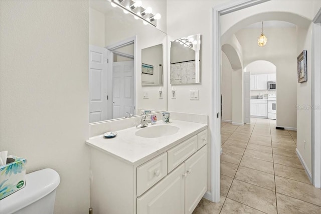2001 Palm Dr Unit 101, Flagler Beach, FL 32136 - bathroom with vanity, tile patterned flooring, and toilet