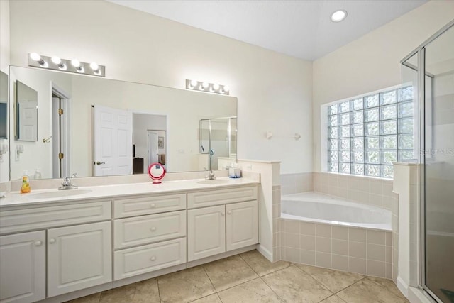 2001 Palm Dr Unit 101, Flagler Beach, FL 32136 - bathroom with a sink, a bath, tile patterned floors, and a shower stall