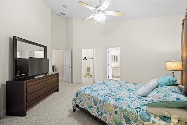 2001 Palm Dr Unit 101, Flagler Beach, FL 32136 - bedroom with a high ceiling, visible vents, light carpet, and baseboards