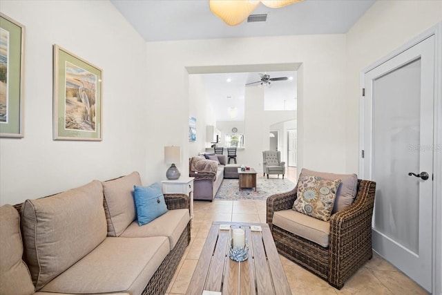 2001 Palm Dr Unit 101, Flagler Beach, FL 32136 - living area with visible vents, a ceiling fan, arched walkways, and light tile patterned floors