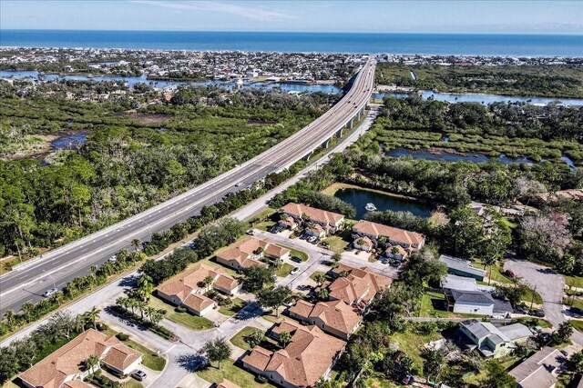 2001 Palm Dr Unit 101, Flagler Beach, FL 32136 - aerial view with a water view and a residential view