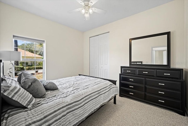 2001 Palm Dr Unit 101, Flagler Beach, FL 32136 - bedroom with a ceiling fan, light colored carpet, and a closet