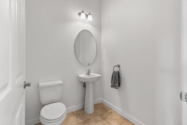 bathroom featuring tile patterned floors, sink, and toilet