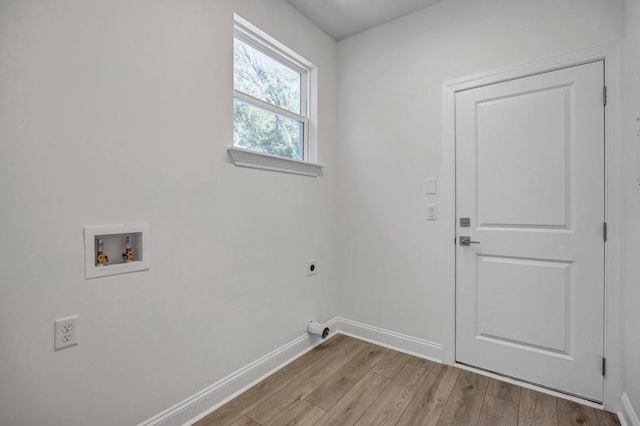 laundry area featuring laundry area, electric dryer hookup, hookup for a washing machine, baseboards, and wood finished floors