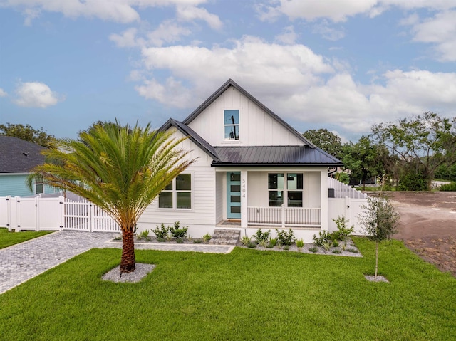 modern farmhouse with a porch and a front yard