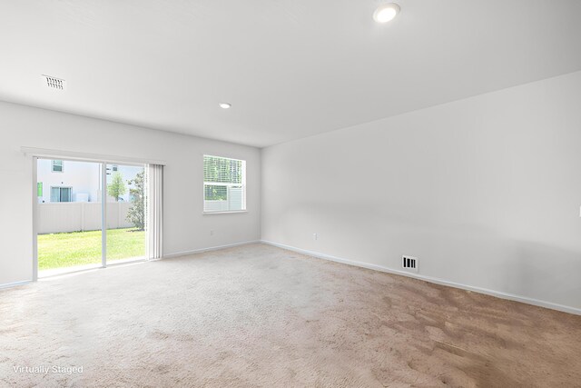 unfurnished room featuring carpet floors