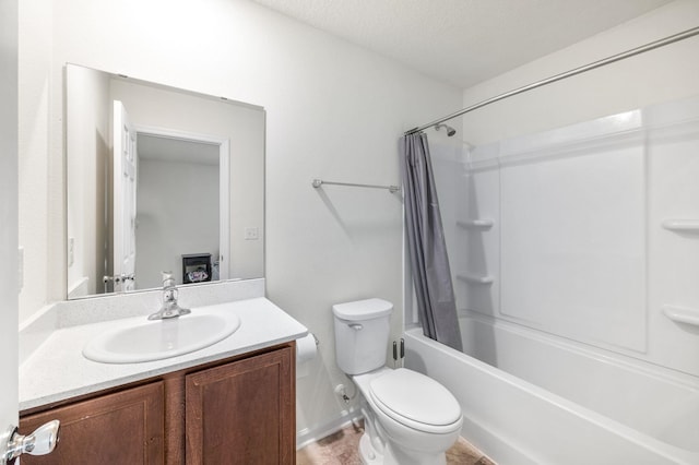 full bathroom featuring shower / tub combo, vanity, a textured ceiling, and toilet