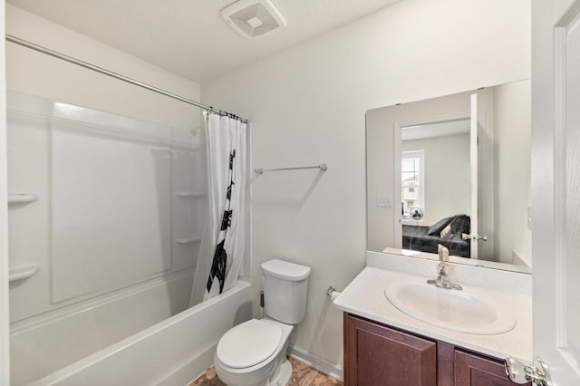 full bathroom featuring shower / bath combination with curtain, vanity, and toilet