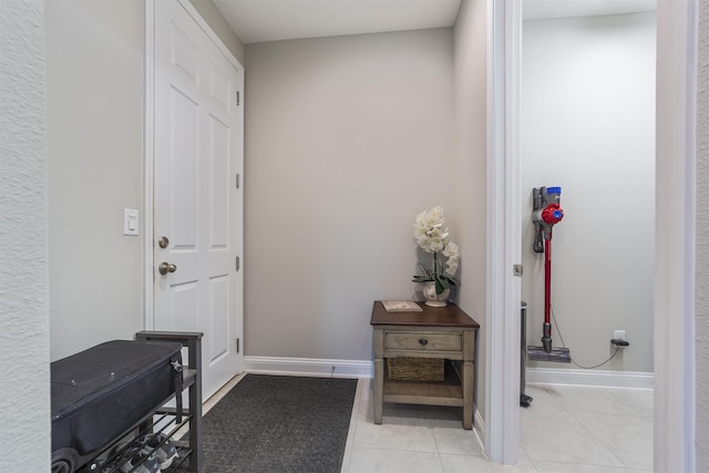 doorway to outside featuring light tile patterned floors