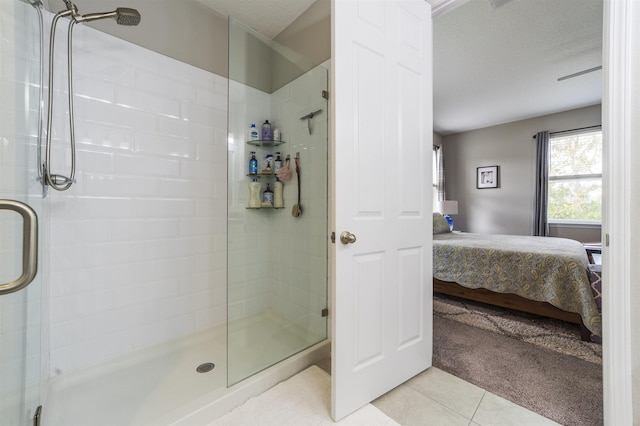 bathroom with tile patterned flooring and walk in shower