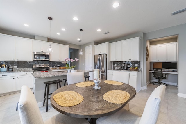 tiled dining space with sink