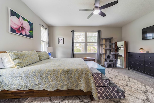 bedroom featuring ceiling fan and carpet floors