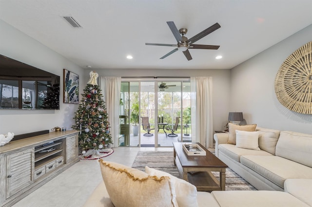 living room with ceiling fan and light tile patterned floors