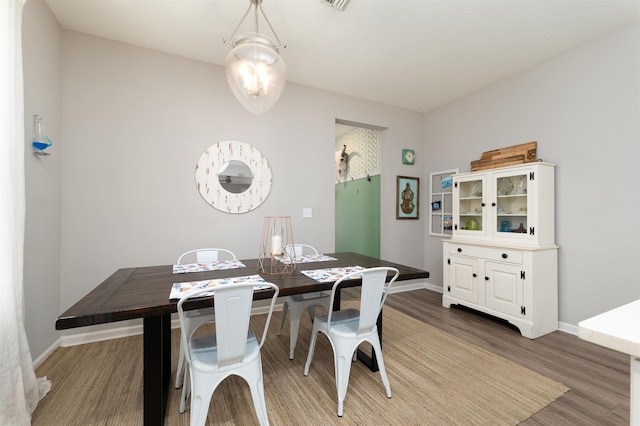 dining area featuring hardwood / wood-style flooring