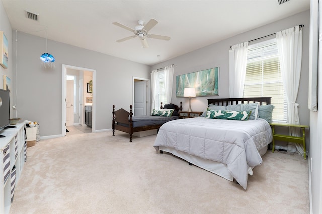 carpeted bedroom featuring connected bathroom and ceiling fan