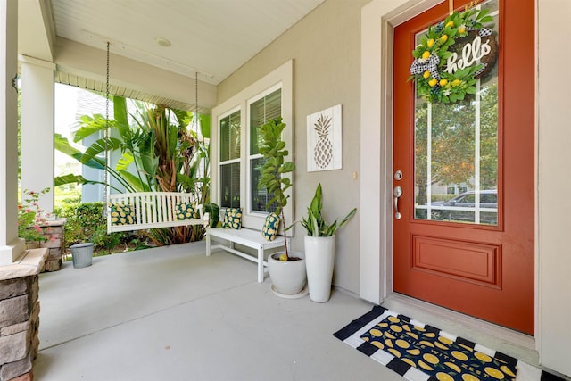 entrance to property featuring a porch