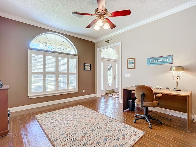 home office featuring ceiling fan, hardwood / wood-style floors, a textured ceiling, and ornamental molding