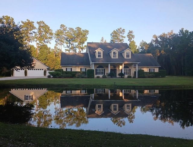 back of house featuring a water view