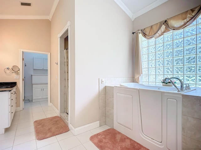 bathroom featuring vanity, lofted ceiling, tile patterned floors, washer and dryer, and ornamental molding