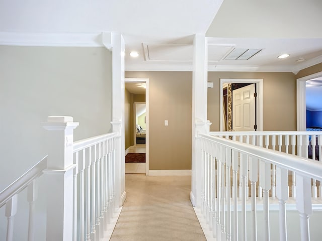 hall with light carpet and ornamental molding