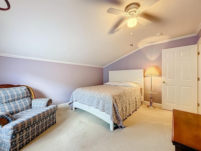 bedroom featuring carpet, a textured ceiling, vaulted ceiling, and ceiling fan