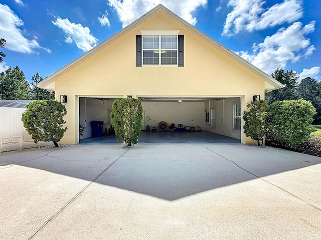 view of side of property with a garage