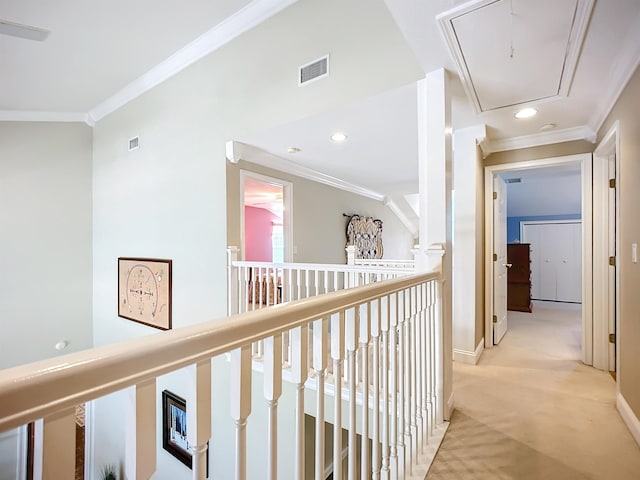 hall with lofted ceiling, light colored carpet, and ornamental molding