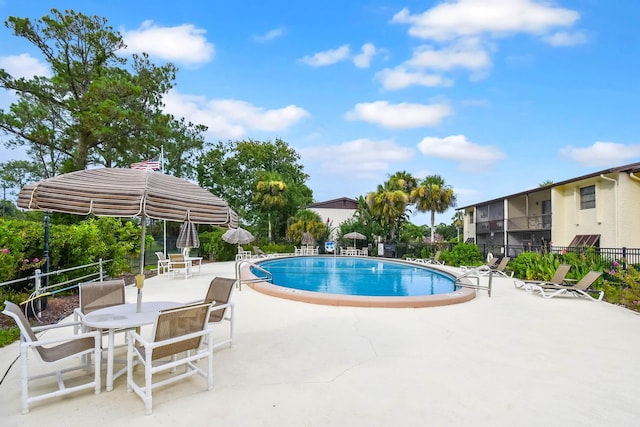 view of swimming pool featuring a patio area